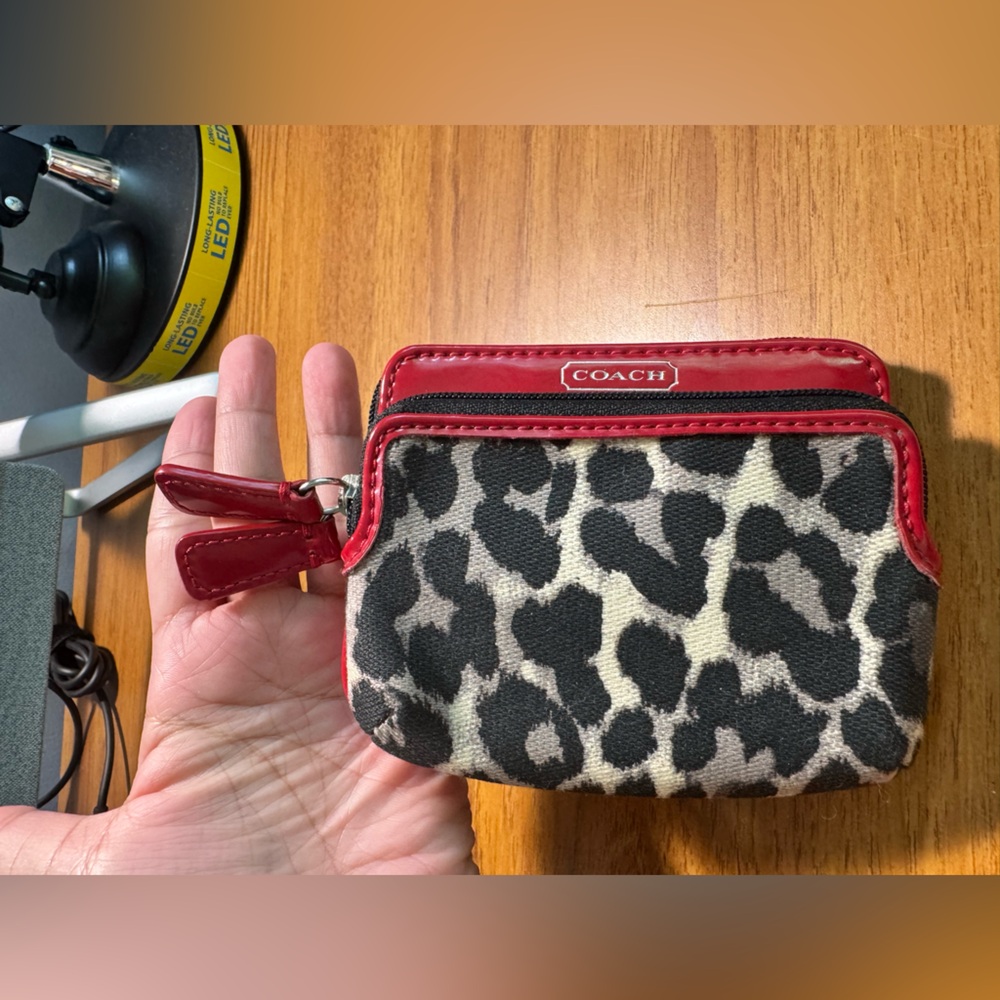 Coach red patent leather, fabric animal print wallet. In great used condition.